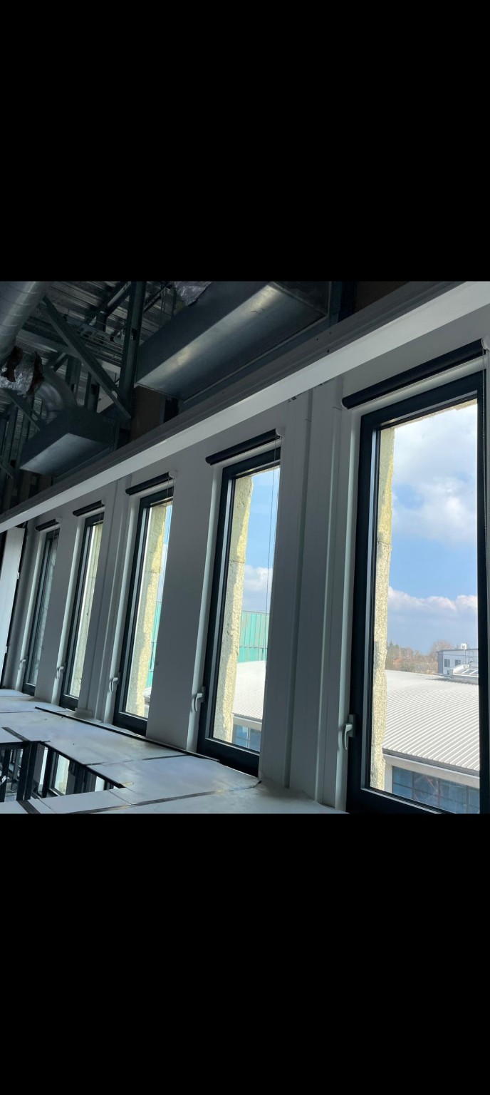 Roller blinds fitted to a run of office windows