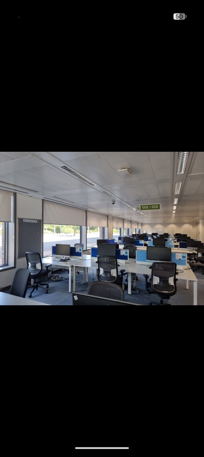 Roller blinds across an open plan office