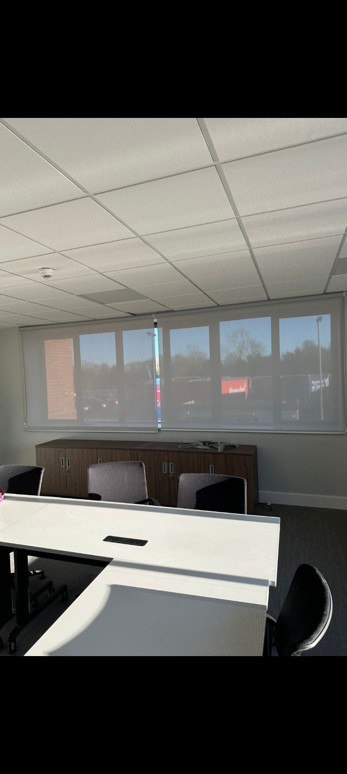 Translucent roller blinds in a meeting room
