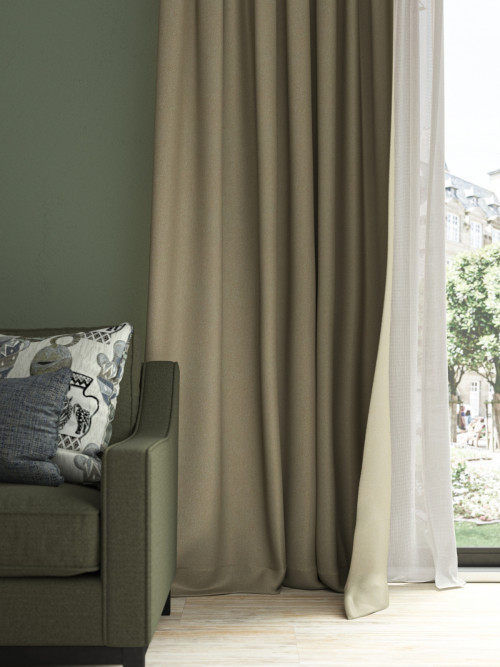 Neutral curtains beside a sheer panel