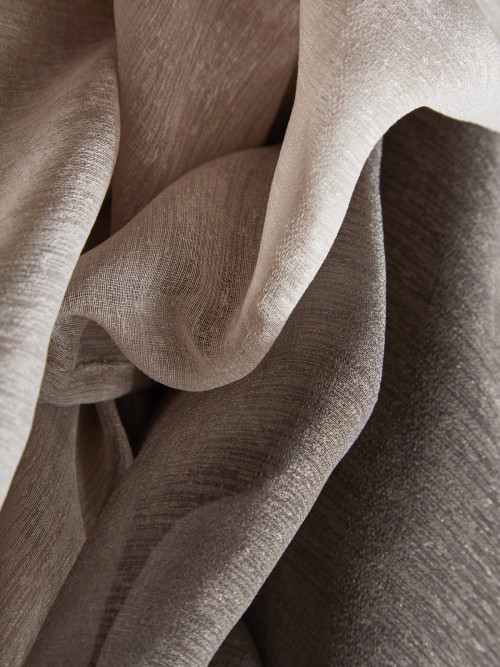 Close view of warm neutral sheer fabric