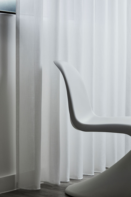 White sheer curtains filtering daylight