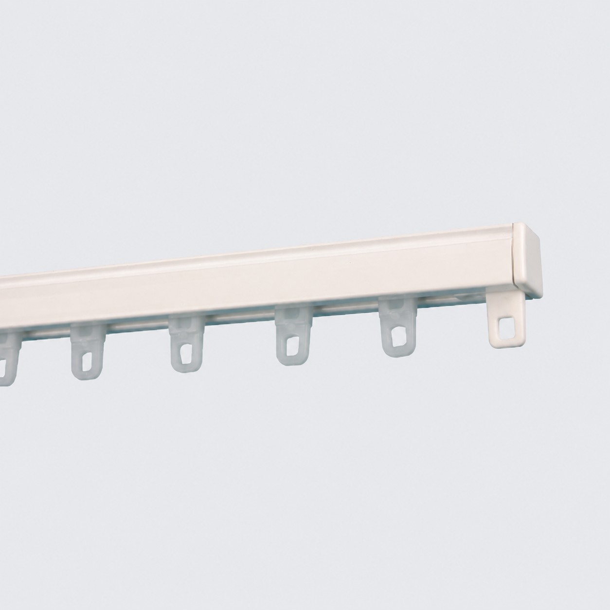 White hand drawn curtain track with gliders
